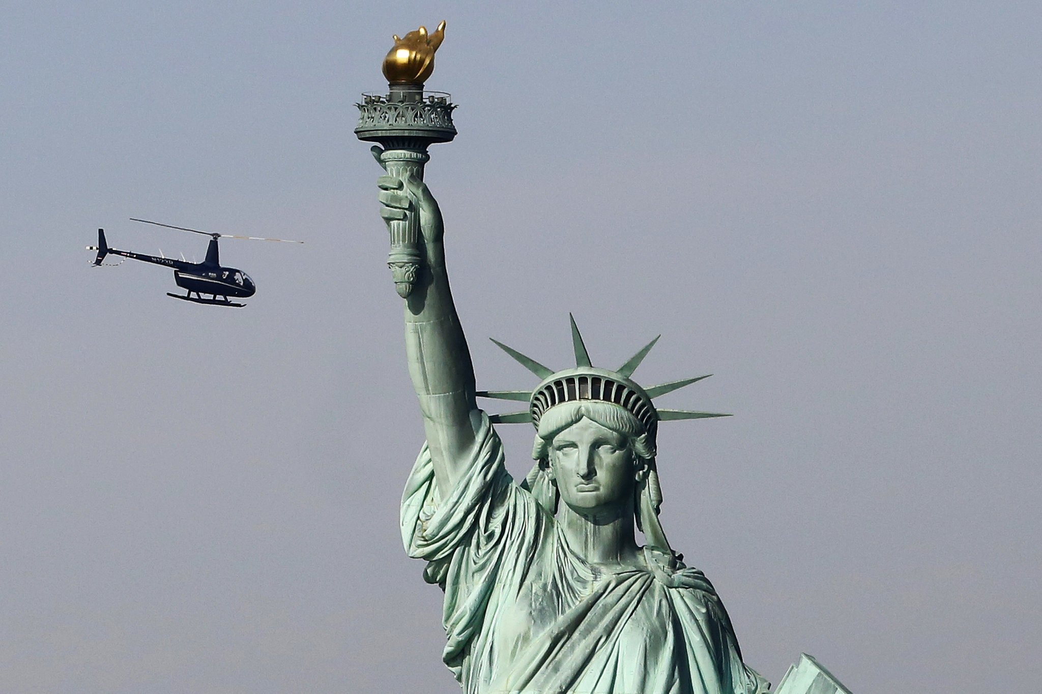 Woman arrested after trying to climb Statue of Liberty in anti-ICE protest