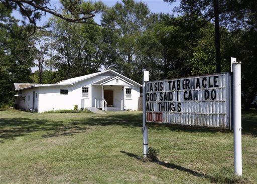 Infant, woman and pastor shot at Alabama church; suspect arrested