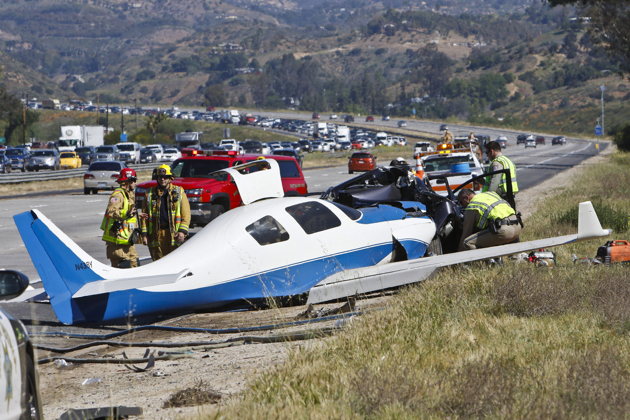 California freeway crash: Small plane lands on car, killing person in vehicle