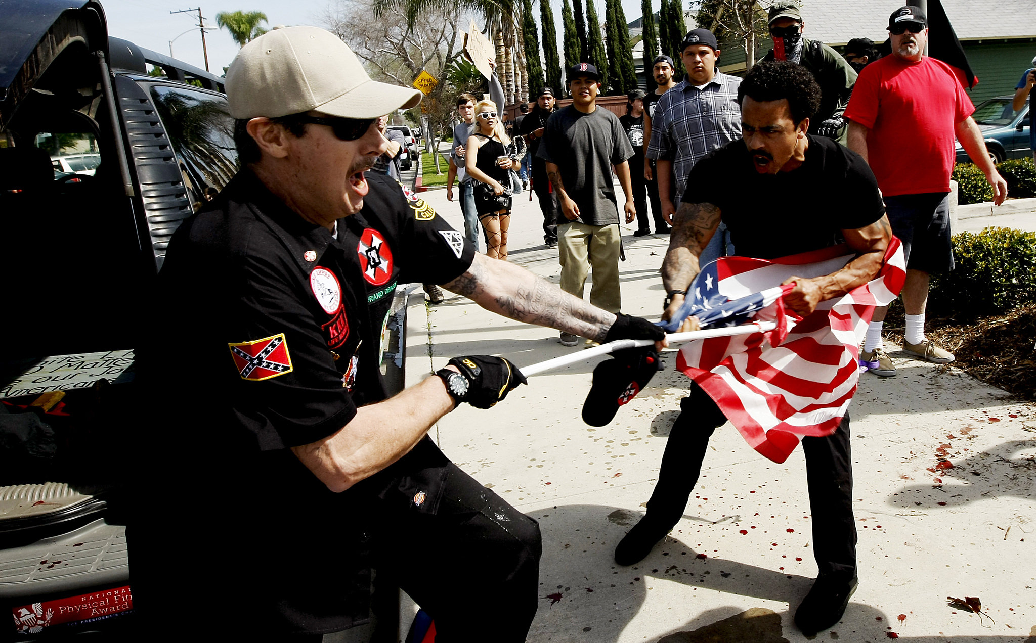 3 stabbed at KKK rally in Calif., including counter-protester injured by flag pole