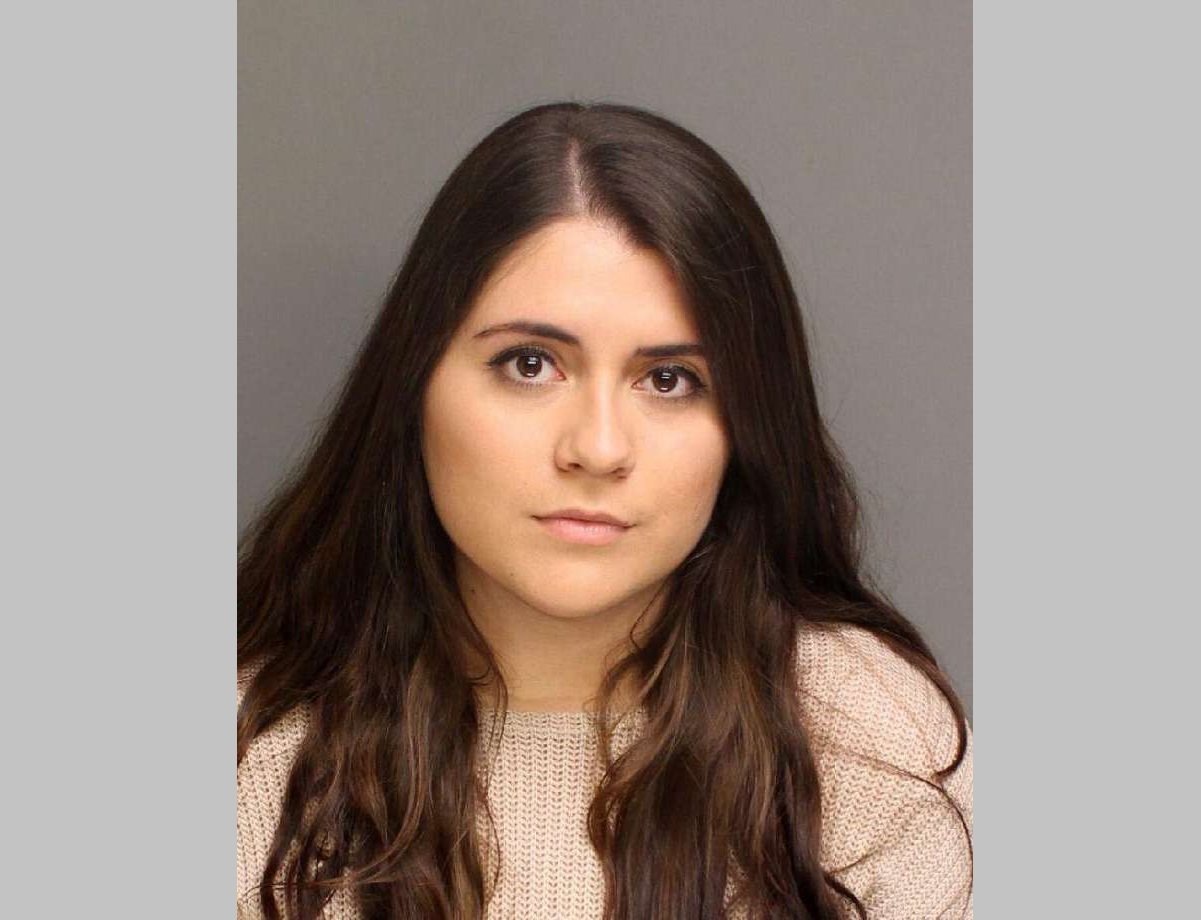 NY woman charged with falsely reporting that 2 football players raped her in bathroom