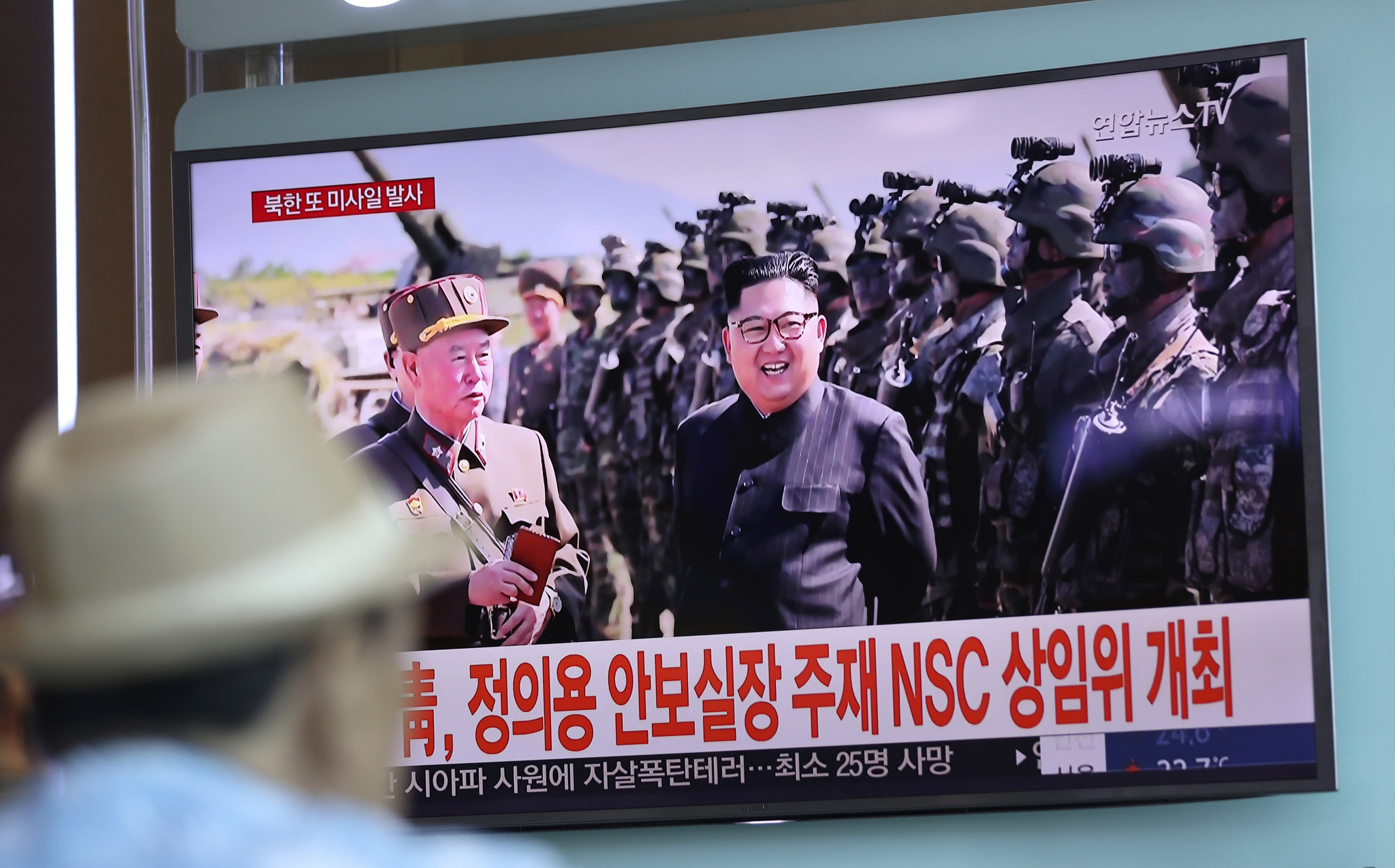 One of three North Korean ballistic missiles flies over Japan; Tokyo issues angry response