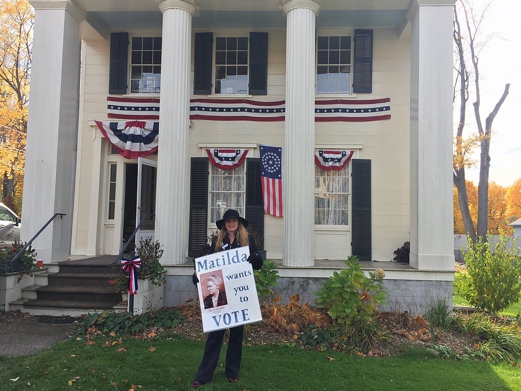 Central New Yorkers remember suffragette with flowers, stickers, balloons on her grave
