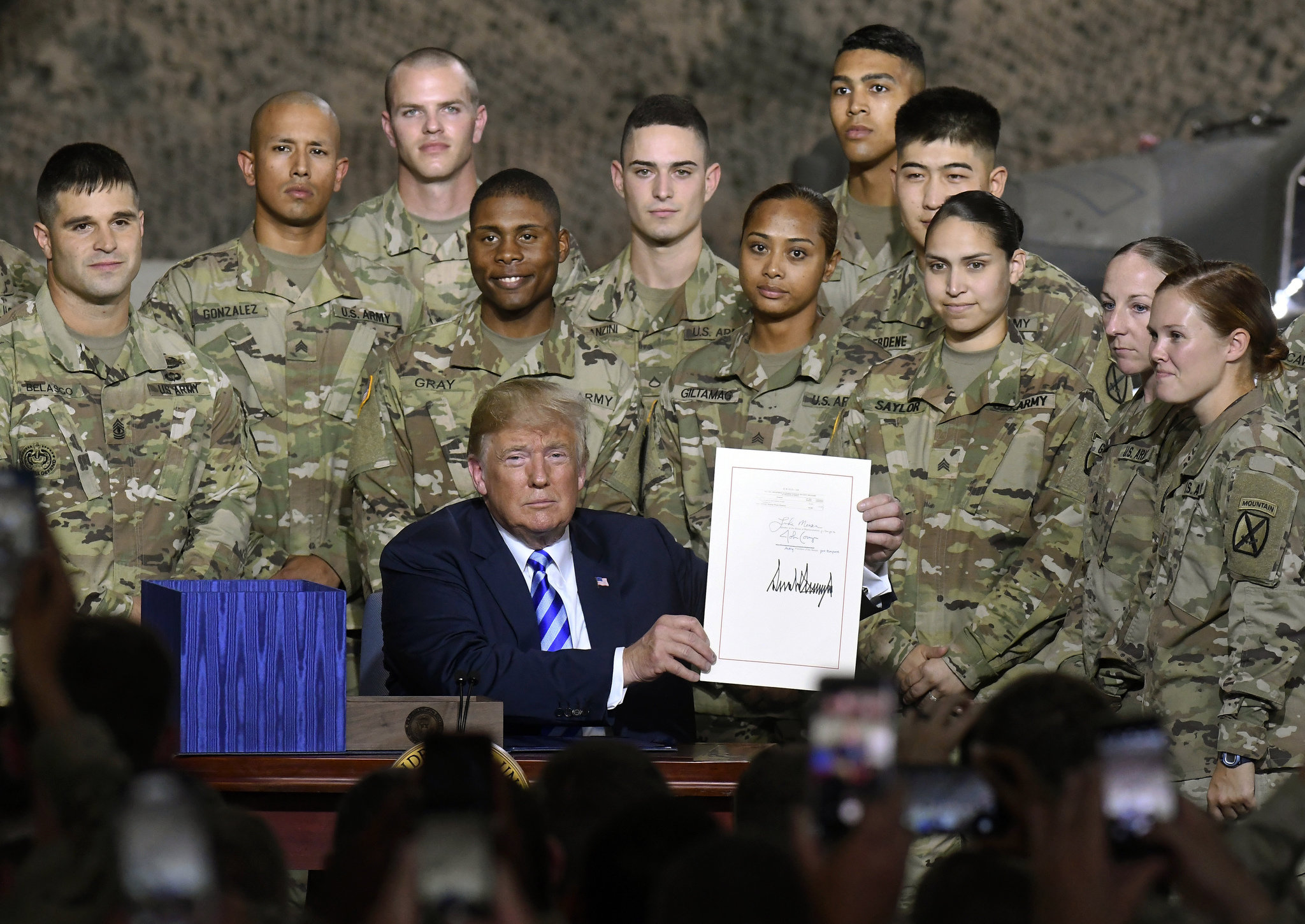 Trump snubs rival John McCain at Fort Drum military bill signing