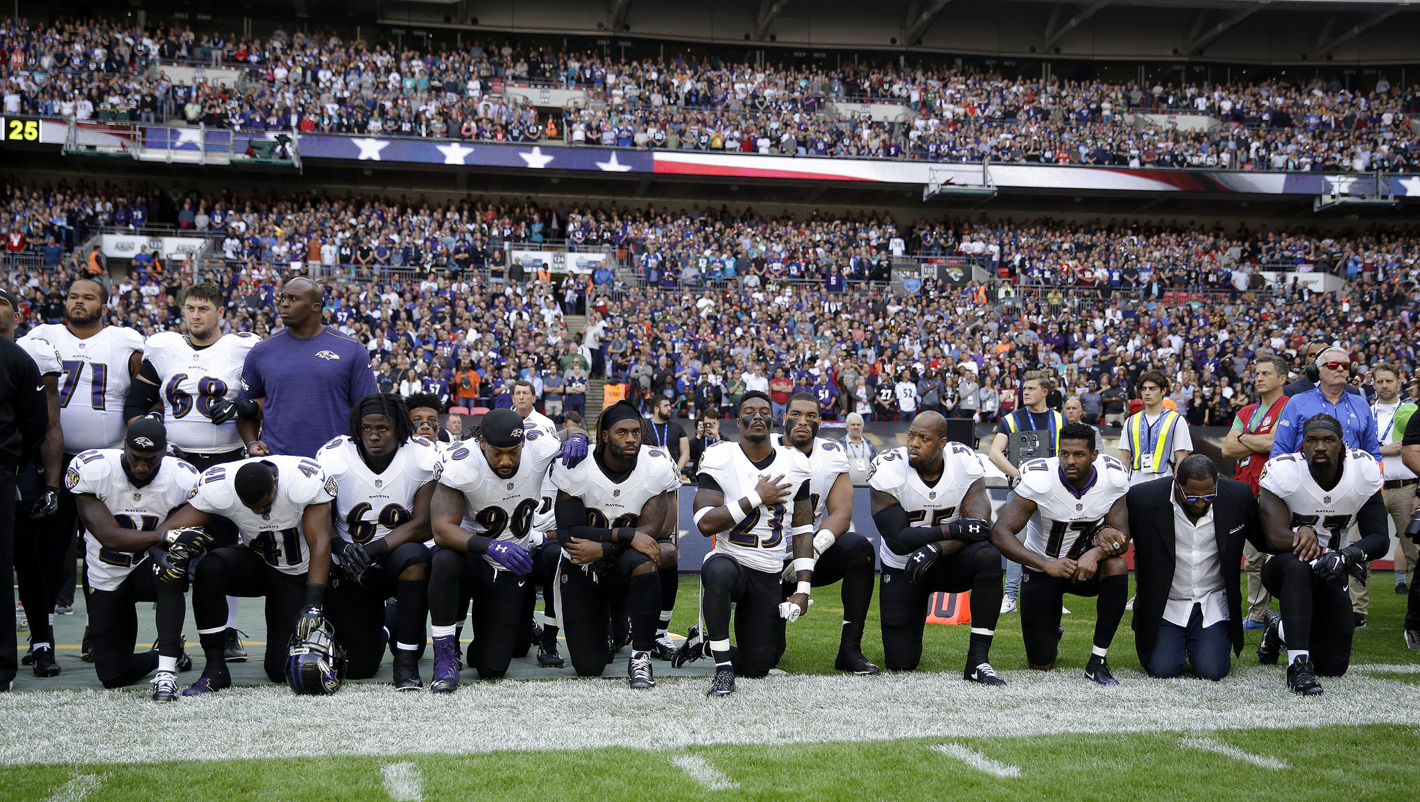 About 2 dozen NFL players kneel for national anthem in London